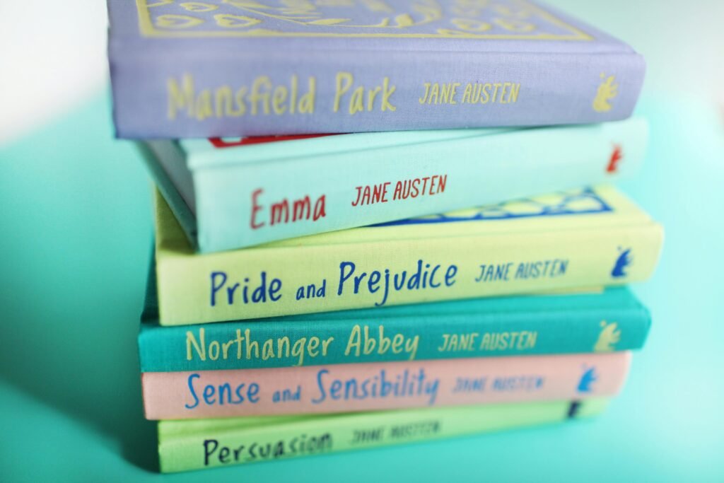 pexels-photo-1666320-1666320-2 A vibrant stack of Jane Austen books against a pastel background, showcasing classic literature.